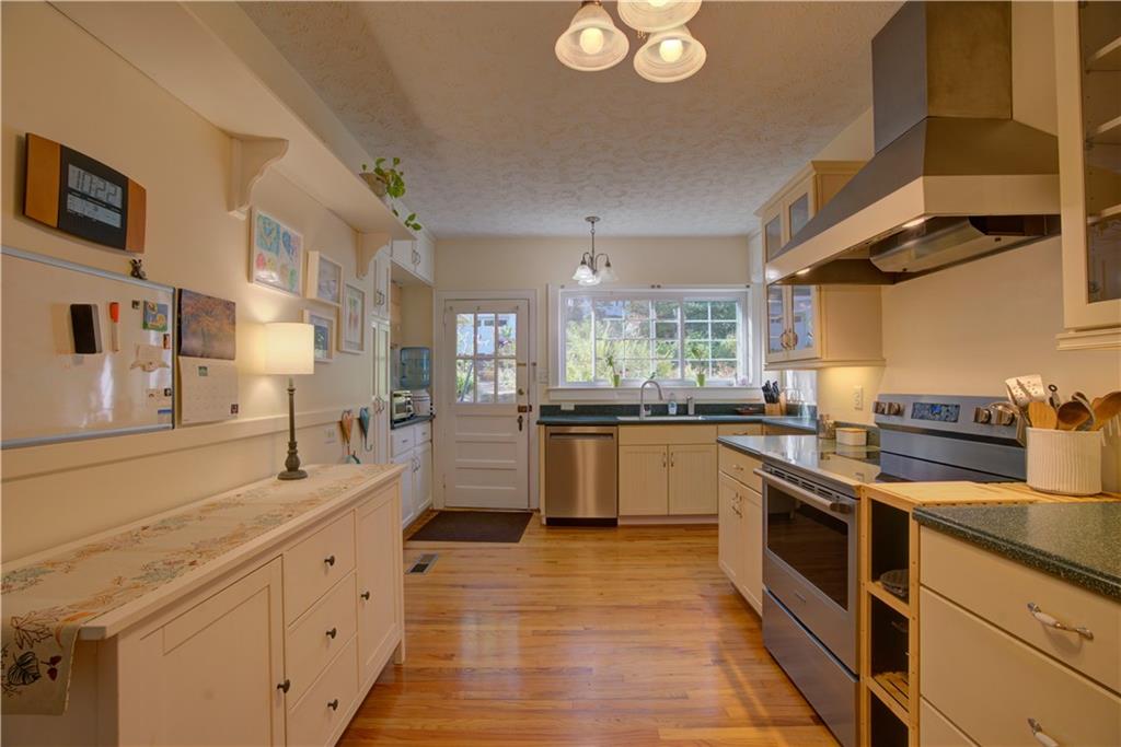 5 Vineland Drive Northwest Rome, GA 30165 - Photo 13 of 54 a kitchen with stainless steel appliances granite countertop a stove a sink and a refrigerator