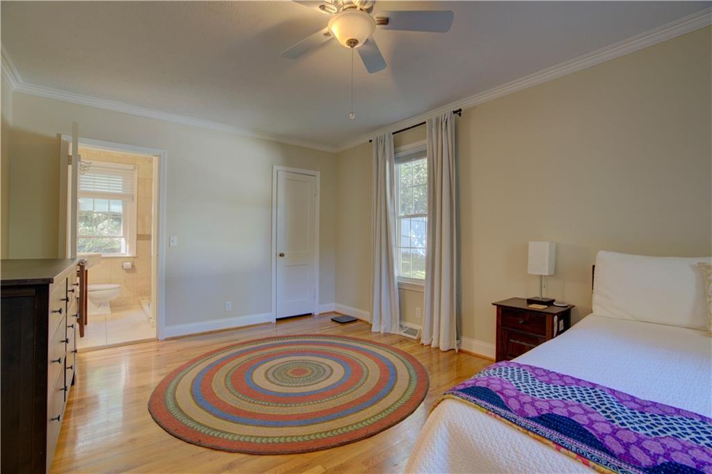 5 Vineland Drive Northwest Rome, GA 30165 - Photo 19 of 54 a bedroom with bed and a chandelier