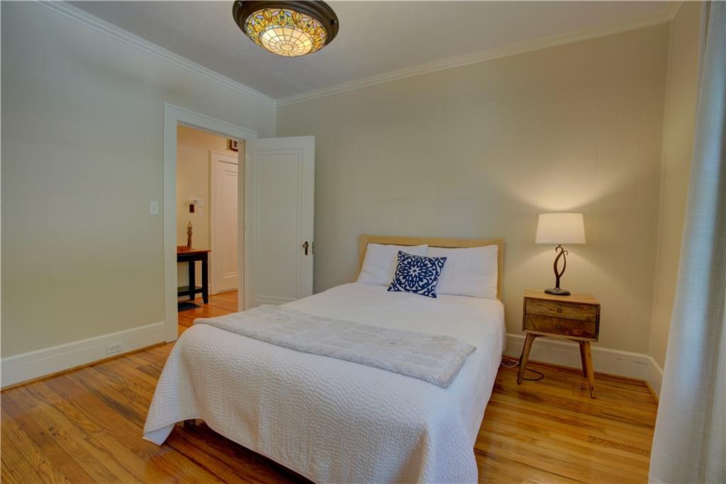 5 Vineland Drive Northwest Rome, GA 30165 - Photo 22 of 54 a bedroom with a bed and a lamp on table