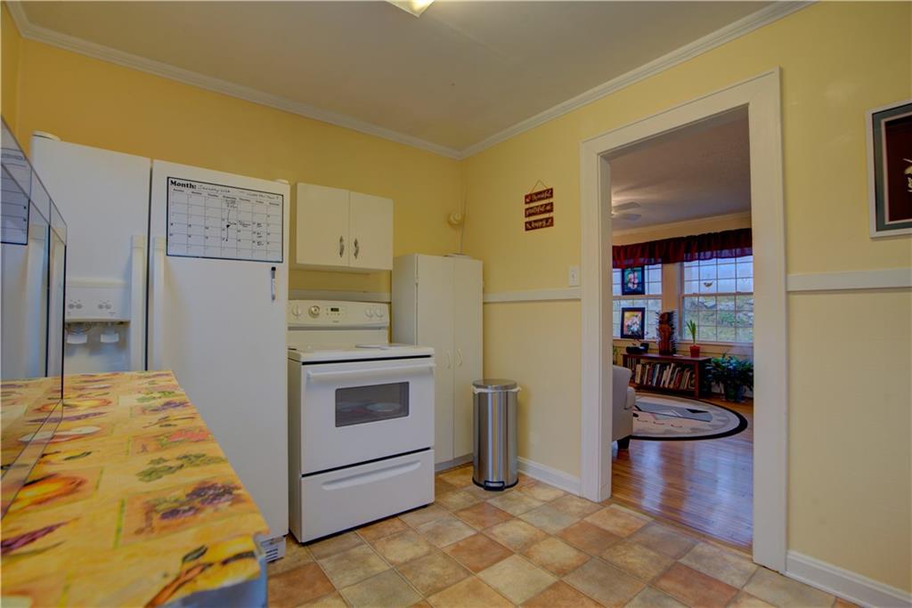 5 Vineland Drive Northwest Rome, GA 30165 - Photo 44 of 54 a kitchen with stainless steel appliances granite countertop a refrigerator and a stove