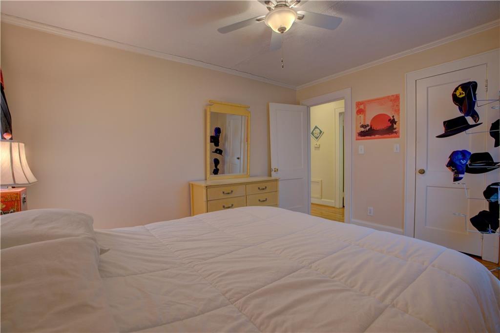 5 Vineland Drive Northwest Rome, GA 30165 - Photo 46 of 54 a bedroom with a bed and a chandelier