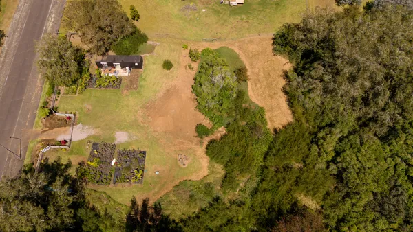 a aerial view of residential houses with swimming pool