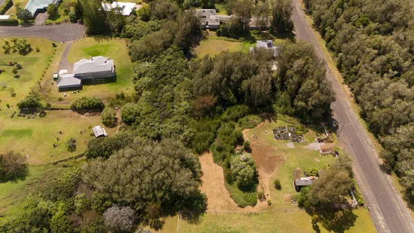 an aerial view of residential houses with outdoor space