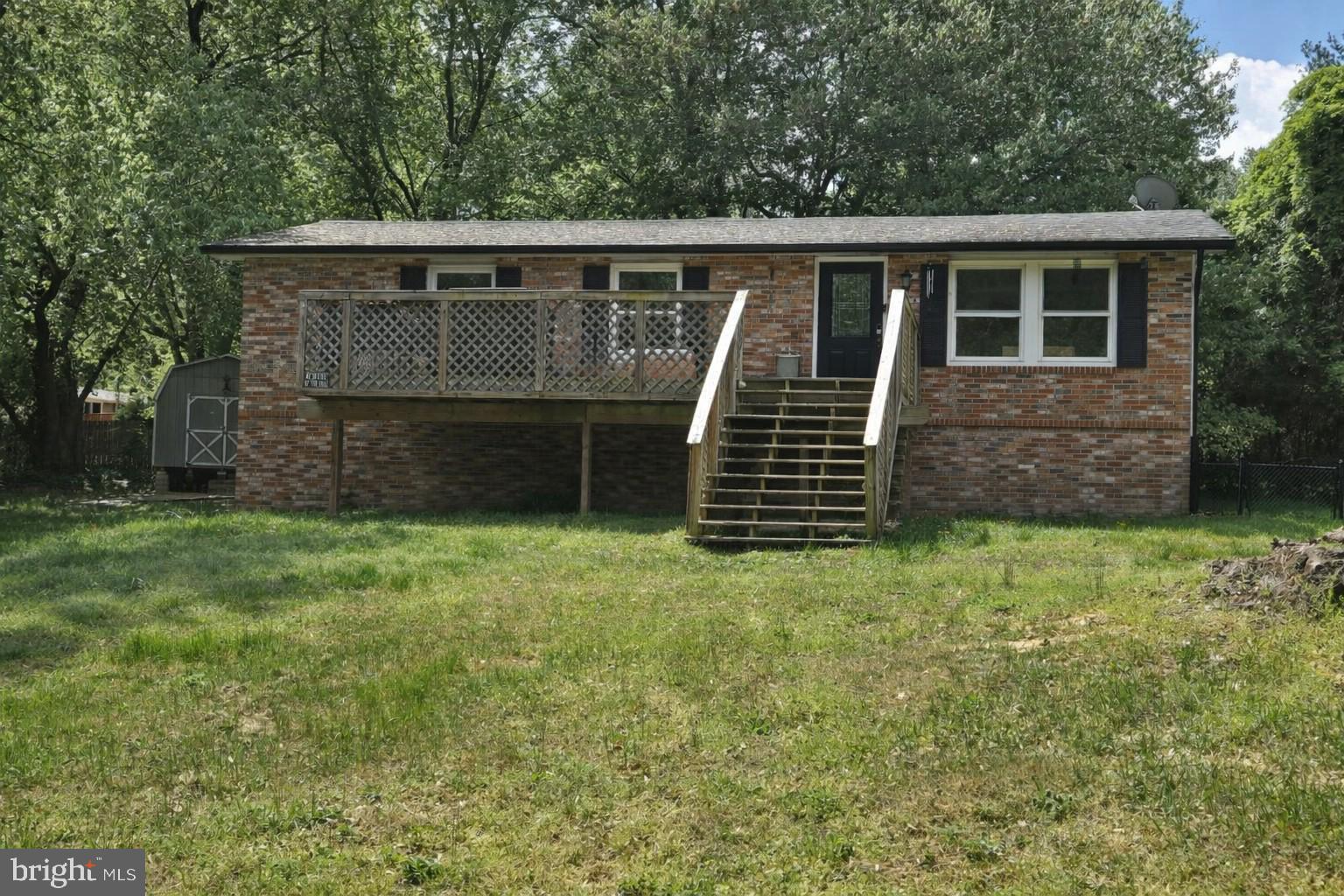 Charming brick home with inviting porch.