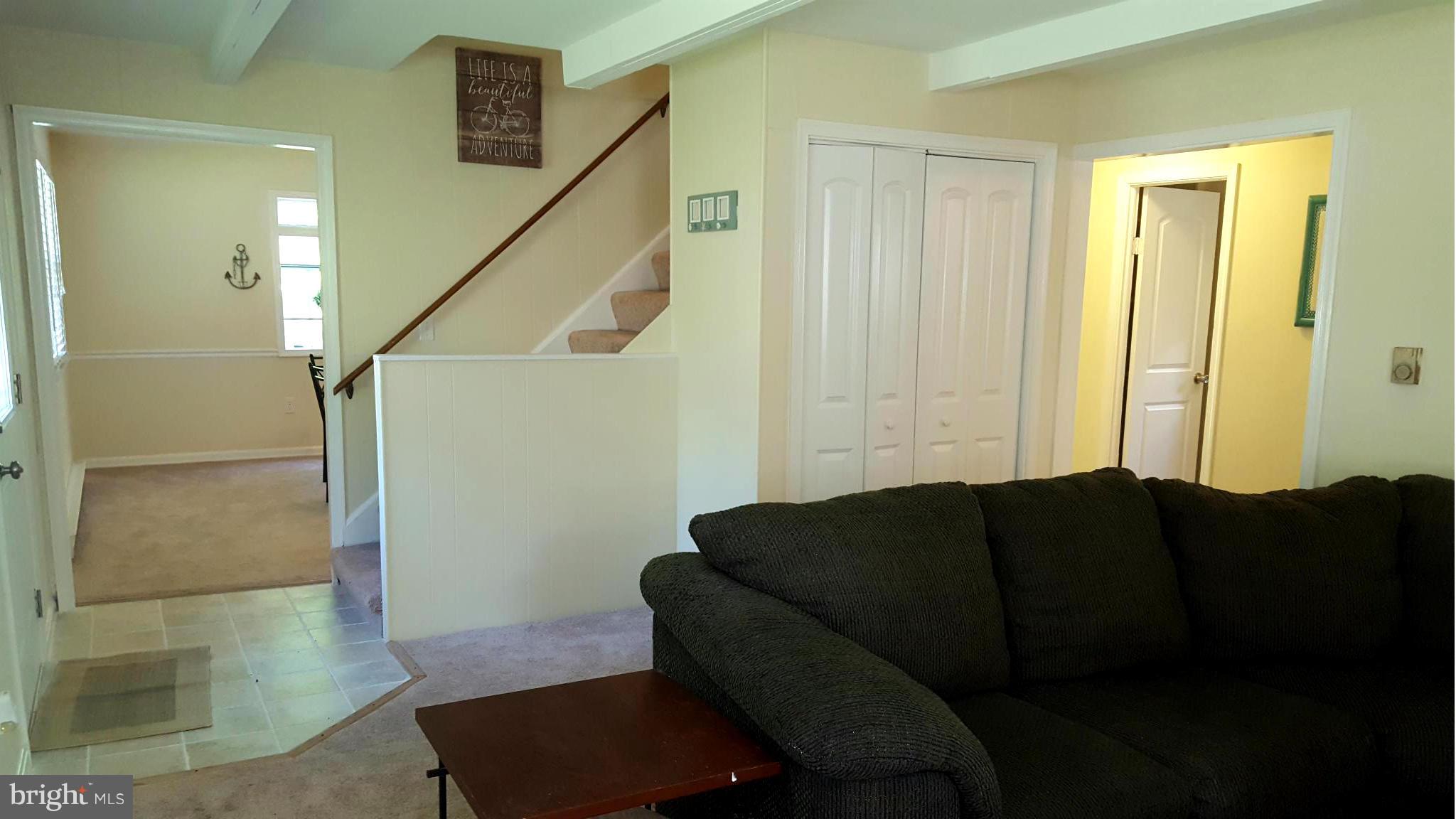 6009 Poplar Road St. Leonard, MD 20685 - Photo 13 of 26 a living room with furniture and a potted plant