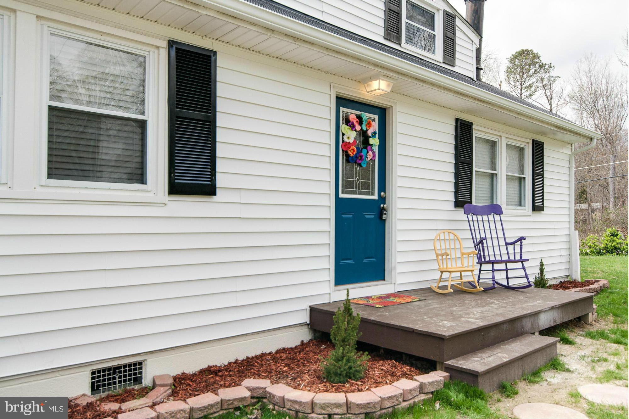 6009 Poplar Road St. Leonard, MD 20685 - Photo 25 of 26 a view of a patio with table and chairs and potted plants