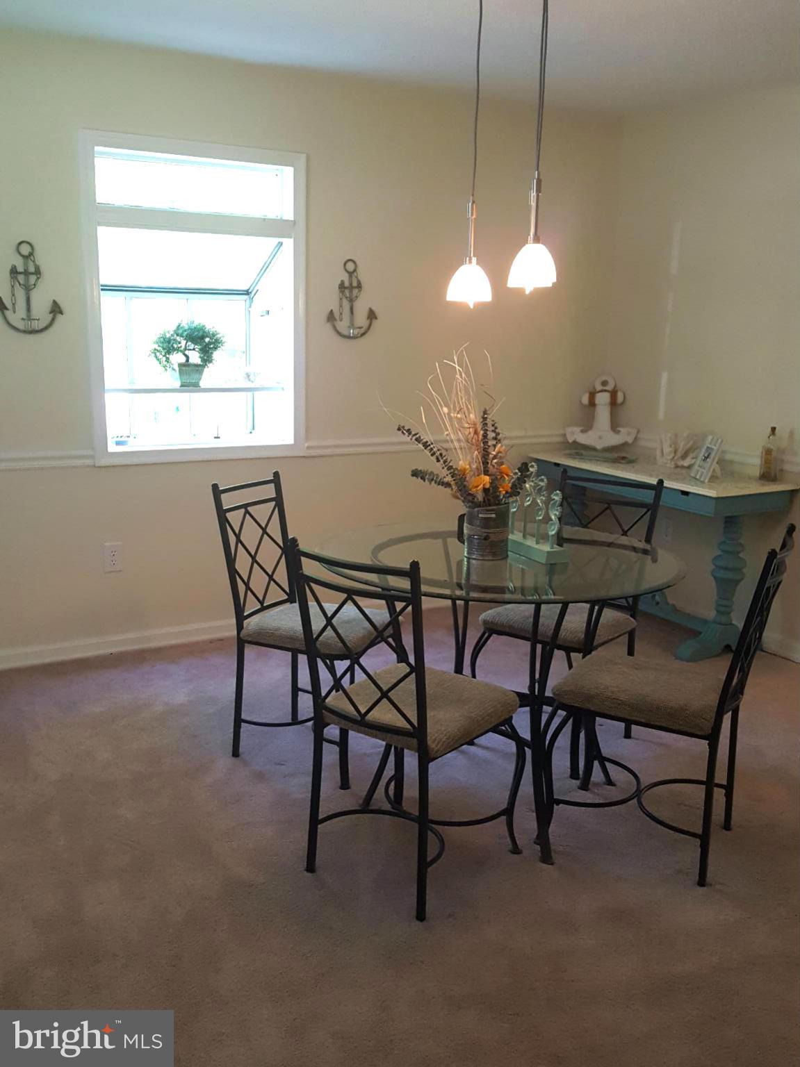 6009 Poplar Road St. Leonard, MD 20685 - Photo 9 of 26 a view of a dining room with furniture window and outside view