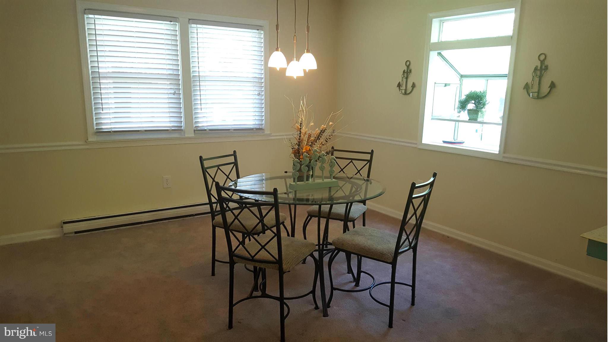 6009 Poplar Road St. Leonard, MD 20685 - Photo 10 of 26 a view of a dining room with furniture and a window