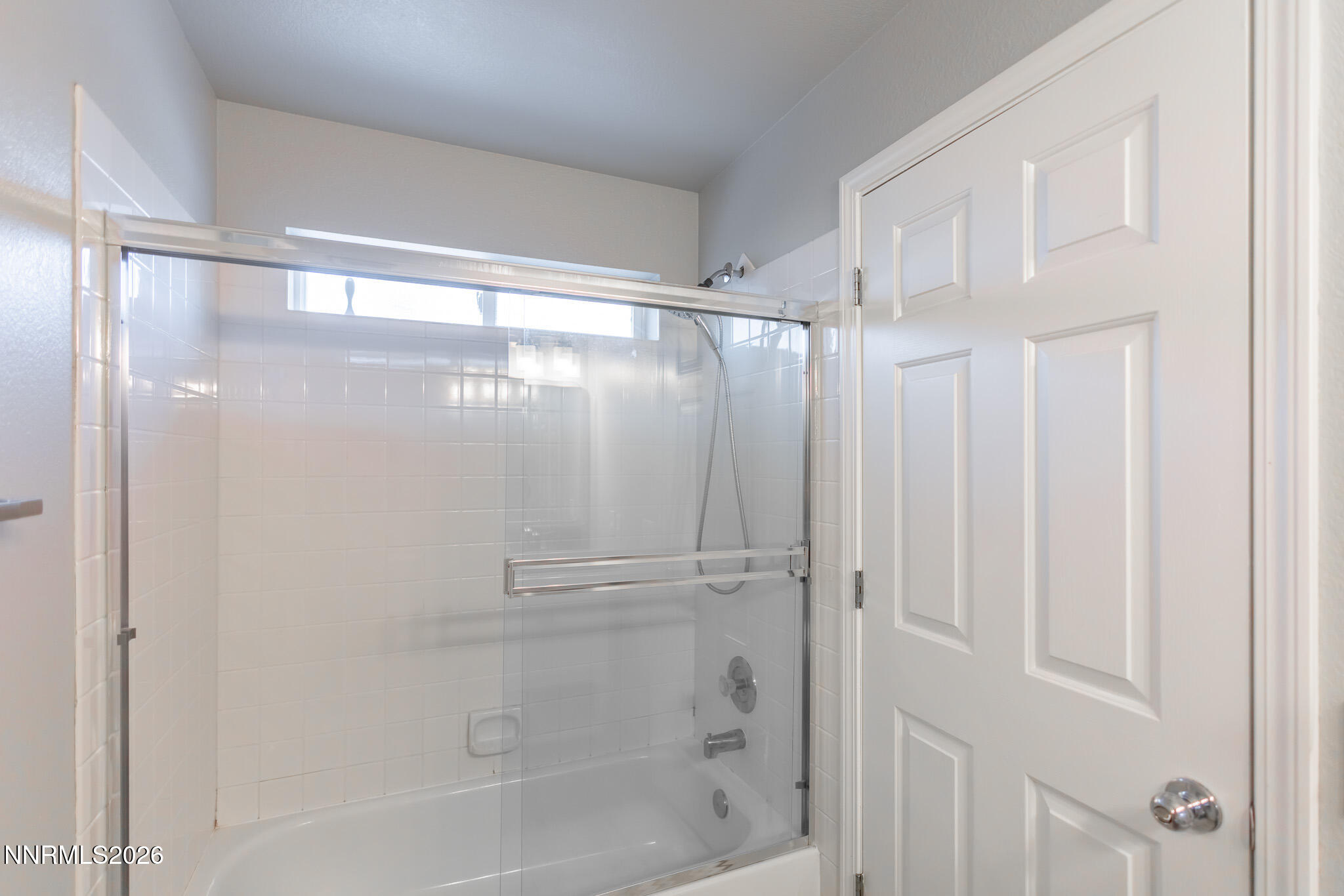 4775 Cedarhill Lane Reno, NV 89519 - Photo 63 of 63 a bathroom with a glass shower door