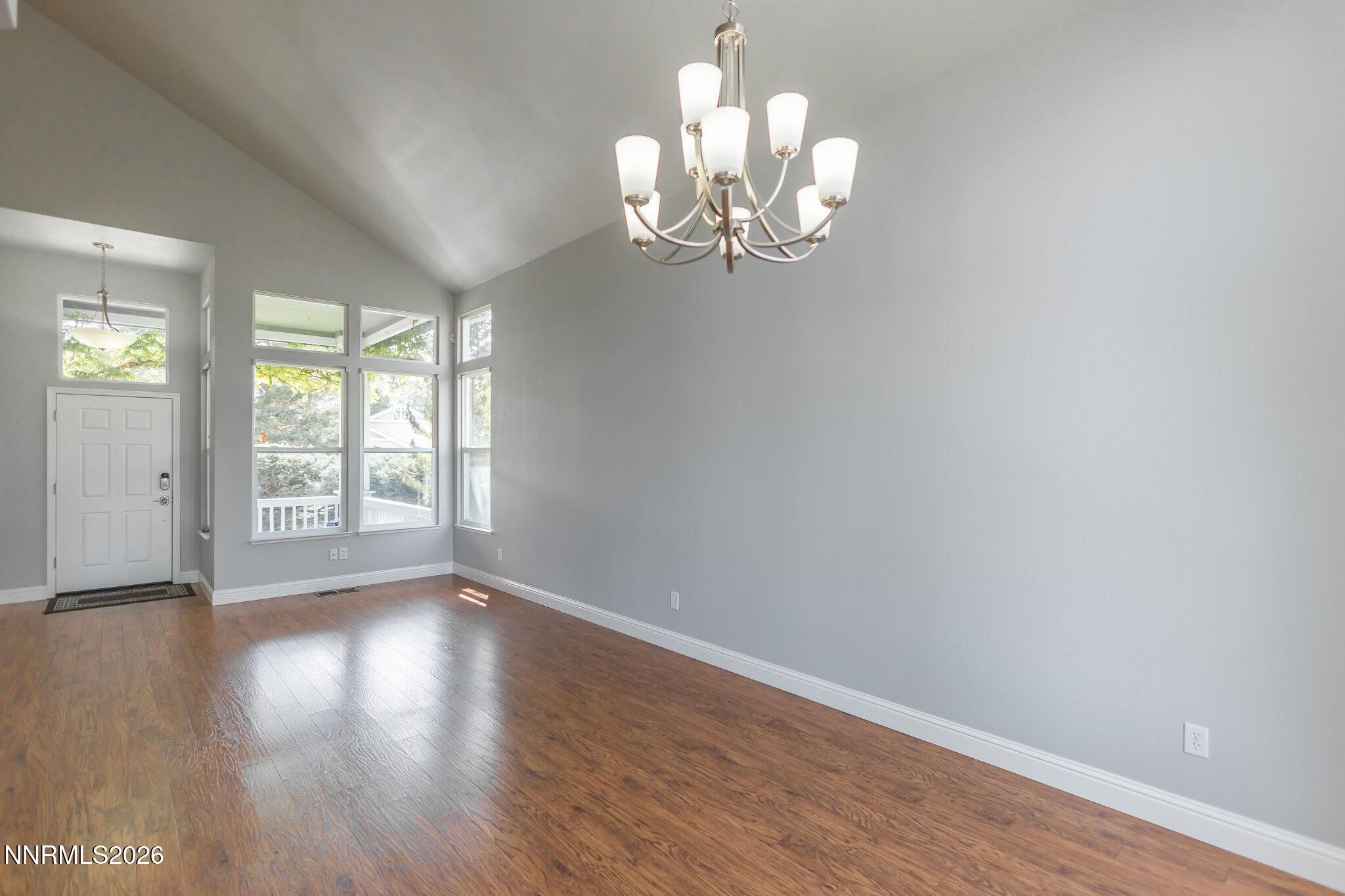 4775 Cedarhill Lane Reno, NV 89519 - Photo 8 of 63 a view of an empty room with wooden floor and a window