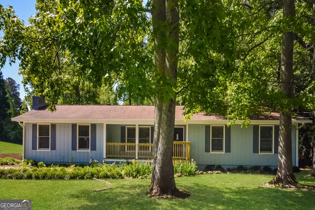 a view of a house with garden and yard