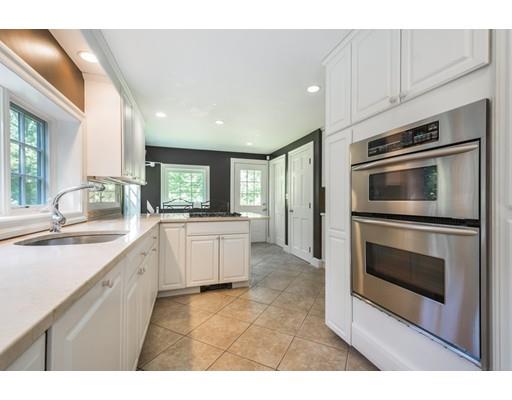 112 Loring Road Weston, MA 02493 - Photo 6 of 24 a large white kitchen with a stove top oven and sink