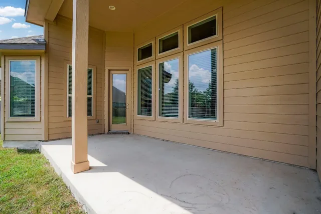 a view of house with backyard