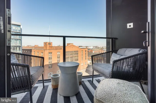 a view of a balcony with furniture