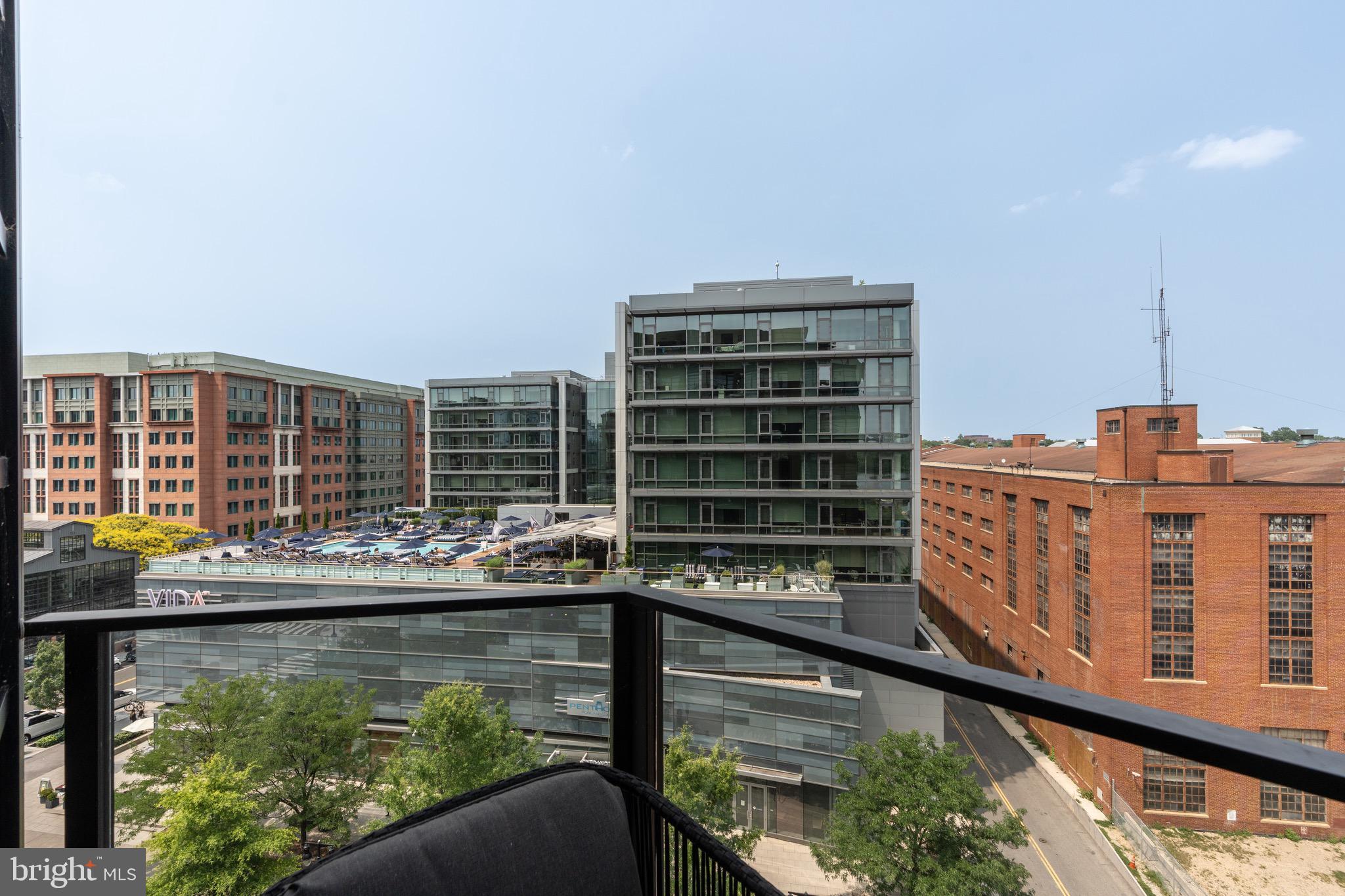 1300 4th Street Southeast, Unit 715 Washington, DC 20003 - Photo 13 of 47 a roof deck with barbeque oven and outdoor seating