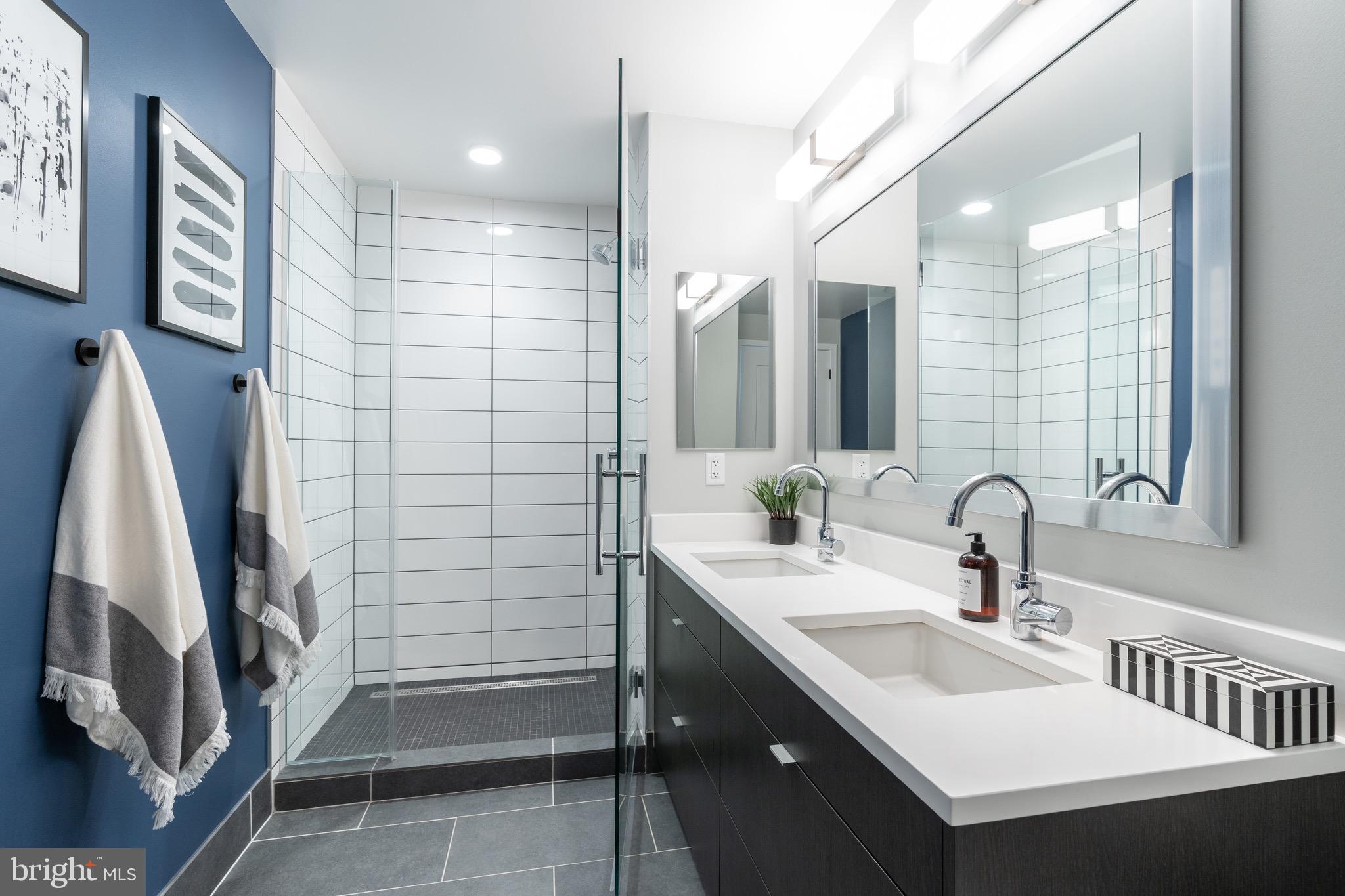 1300 4th Street Southeast, Unit 715 Washington, DC 20003 - Photo 15 of 47 a bathroom with a sink a double vanity and a mirror