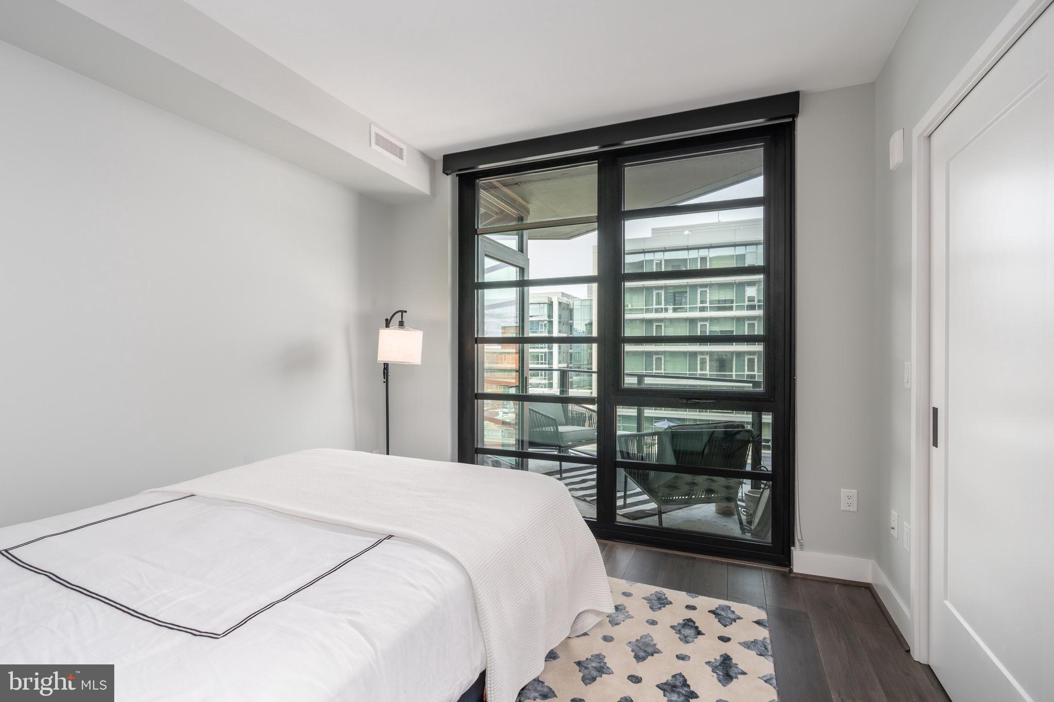 1300 4th Street Southeast, Unit 715 Washington, DC 20003 - Photo 21 of 47 a bedroom with a bed and a window