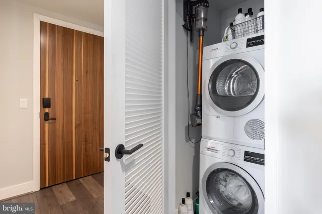a view of a hallway with washer and dryer