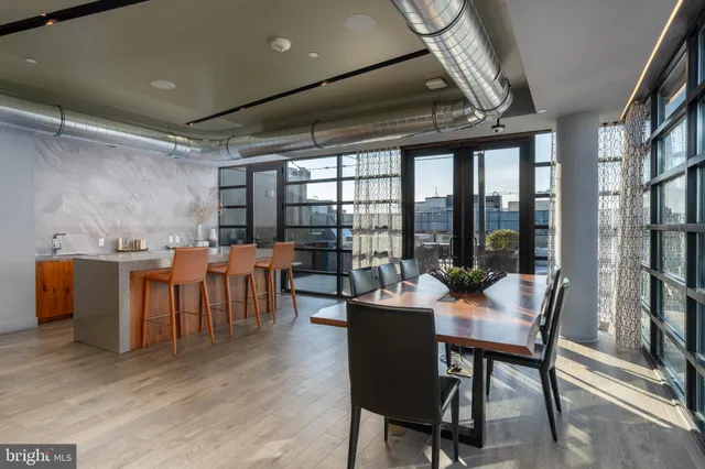 a view of a dining room with furniture window and outside view