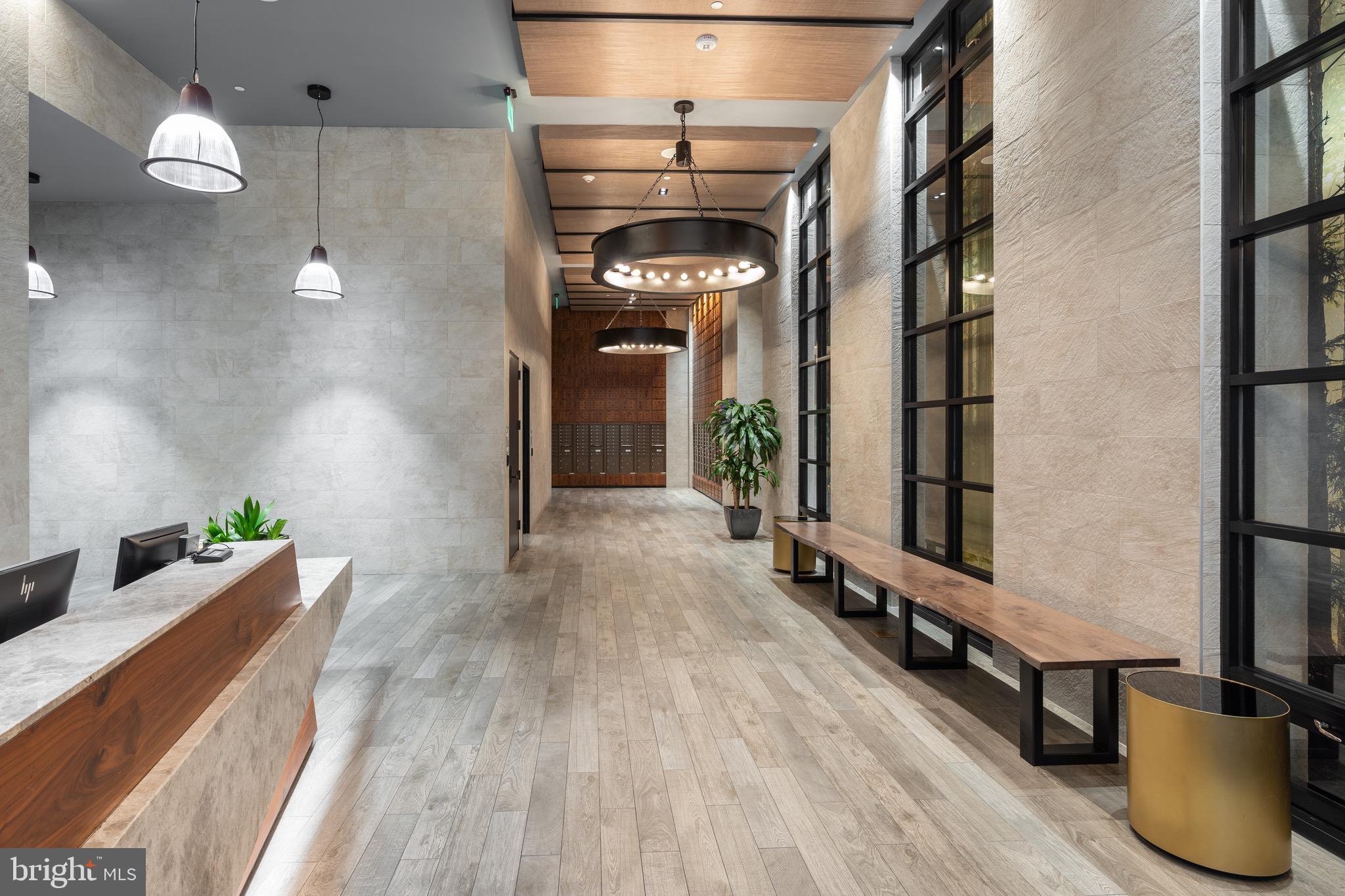 1300 4th Street Southeast, Unit 715 Washington, DC 20003 - Photo 38 of 47 a view of a hallway with wooden floor and staircase