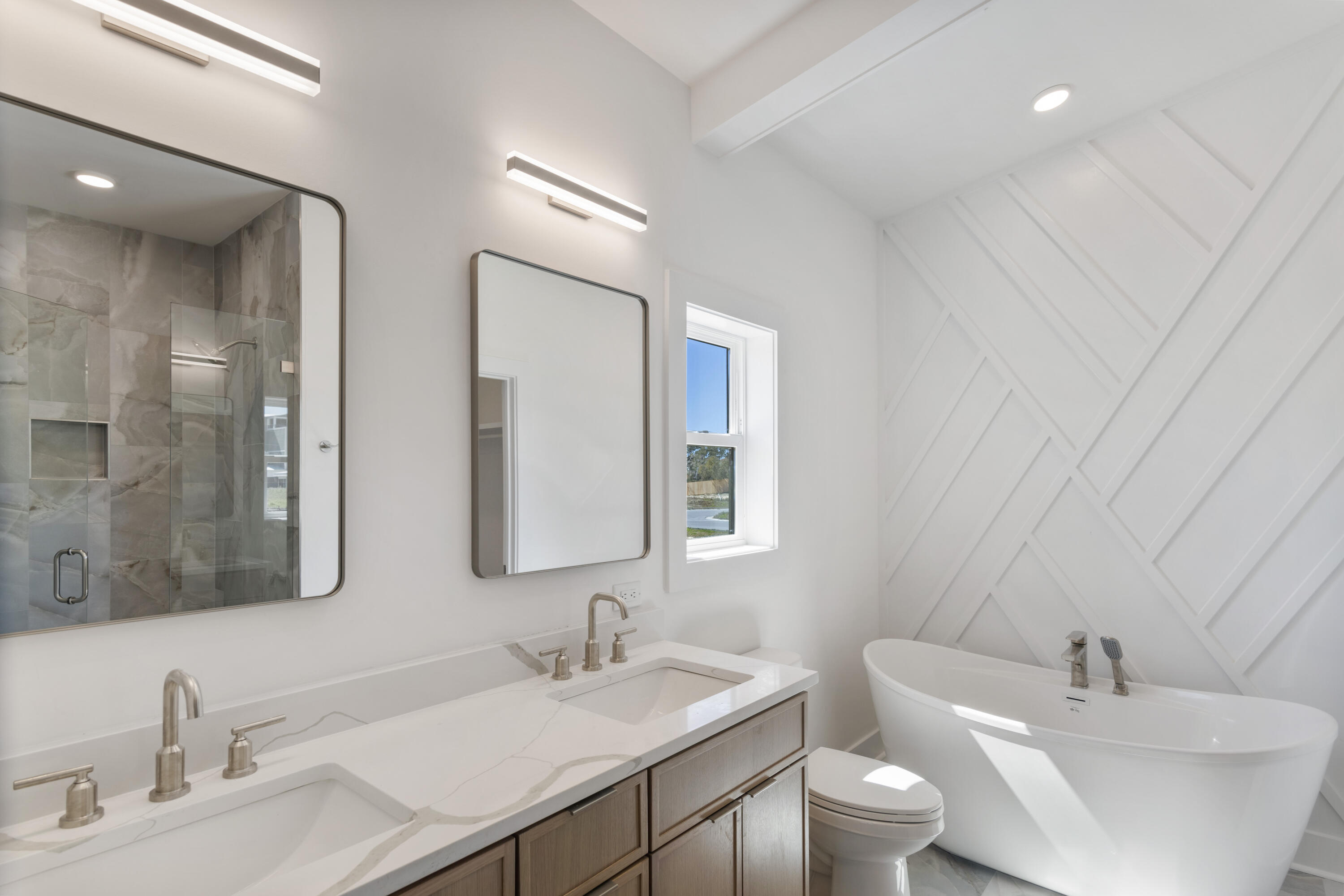 31 Asher St Inlet Beach, Unit LOT 43 Inlet Beach, FL 32461 - Photo 17 of 44 a bathroom with double vanity sinks and a mirror