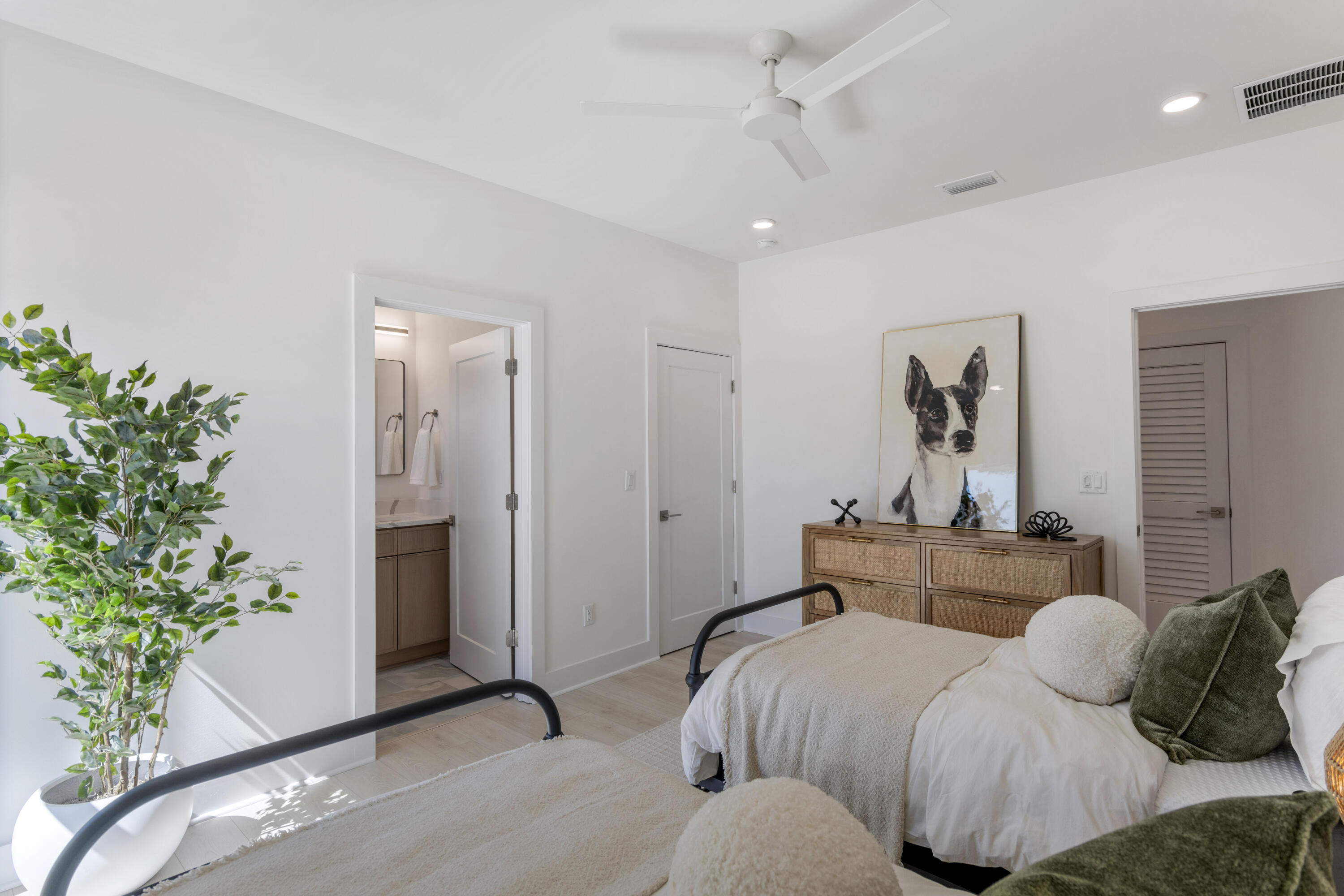 31 Asher St Inlet Beach, Unit LOT 43 Inlet Beach, FL 32461 - Photo 27 of 44 a bedroom with a bed and a potted plant