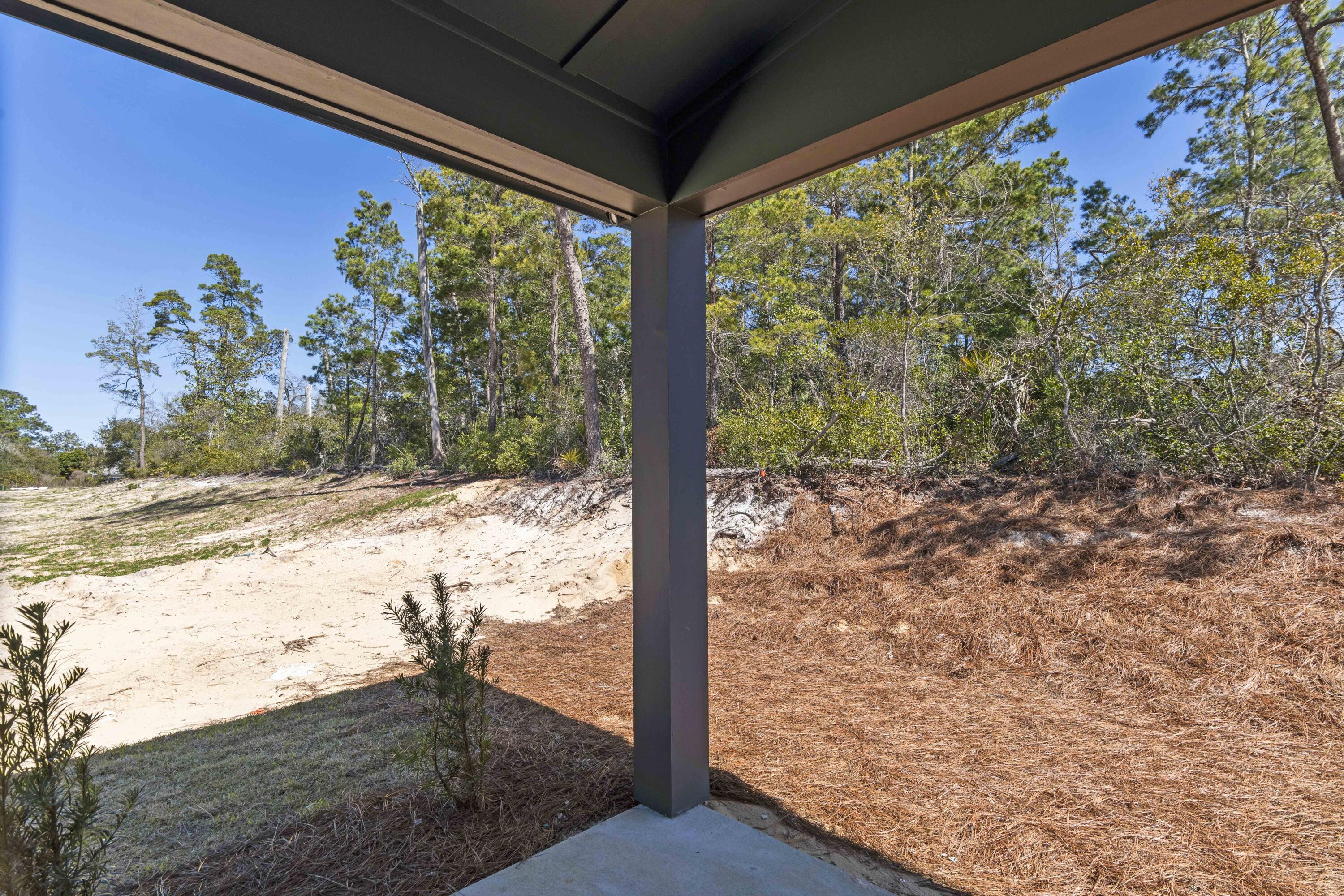 31 Asher St Inlet Beach, Unit LOT 43 Inlet Beach, FL 32461 - Photo 29 of 44 a view of a yard with wooden fence