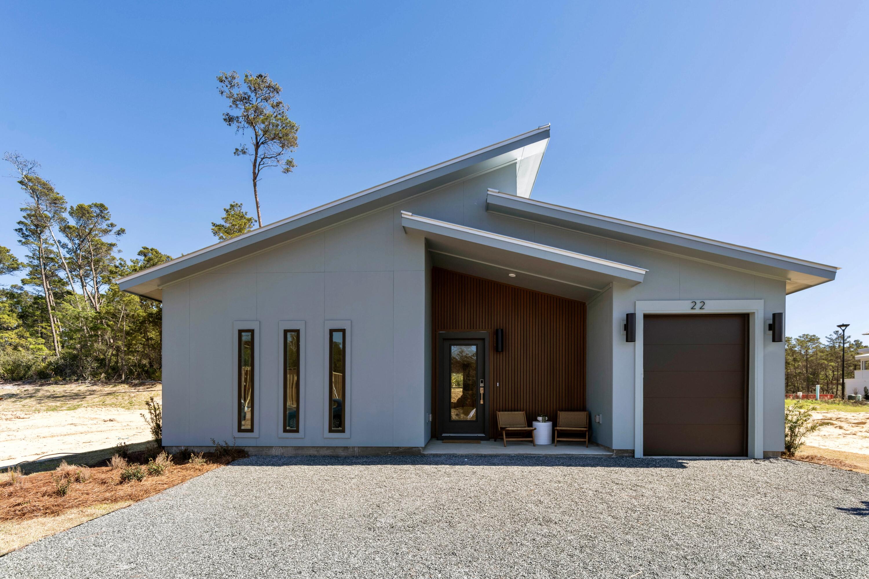31 Asher St Inlet Beach, Unit LOT 43 Inlet Beach, FL 32461 - Photo 4 of 44 a front view of a house with a yard
