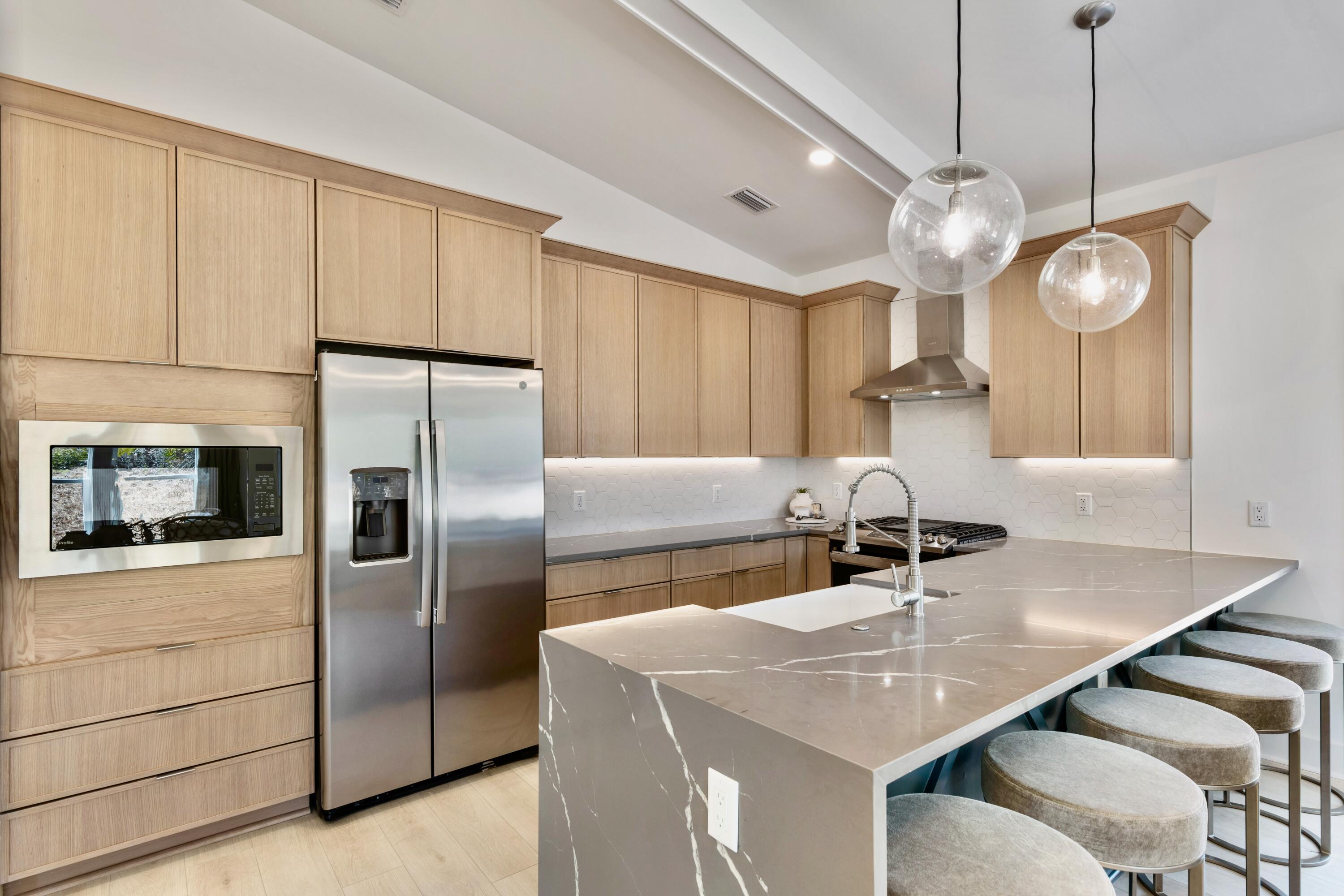 31 Asher St Inlet Beach, Unit LOT 43 Inlet Beach, FL 32461 - Photo 6 of 44 a kitchen with stainless steel appliances granite countertop a sink a refrigerator and a refrigerator