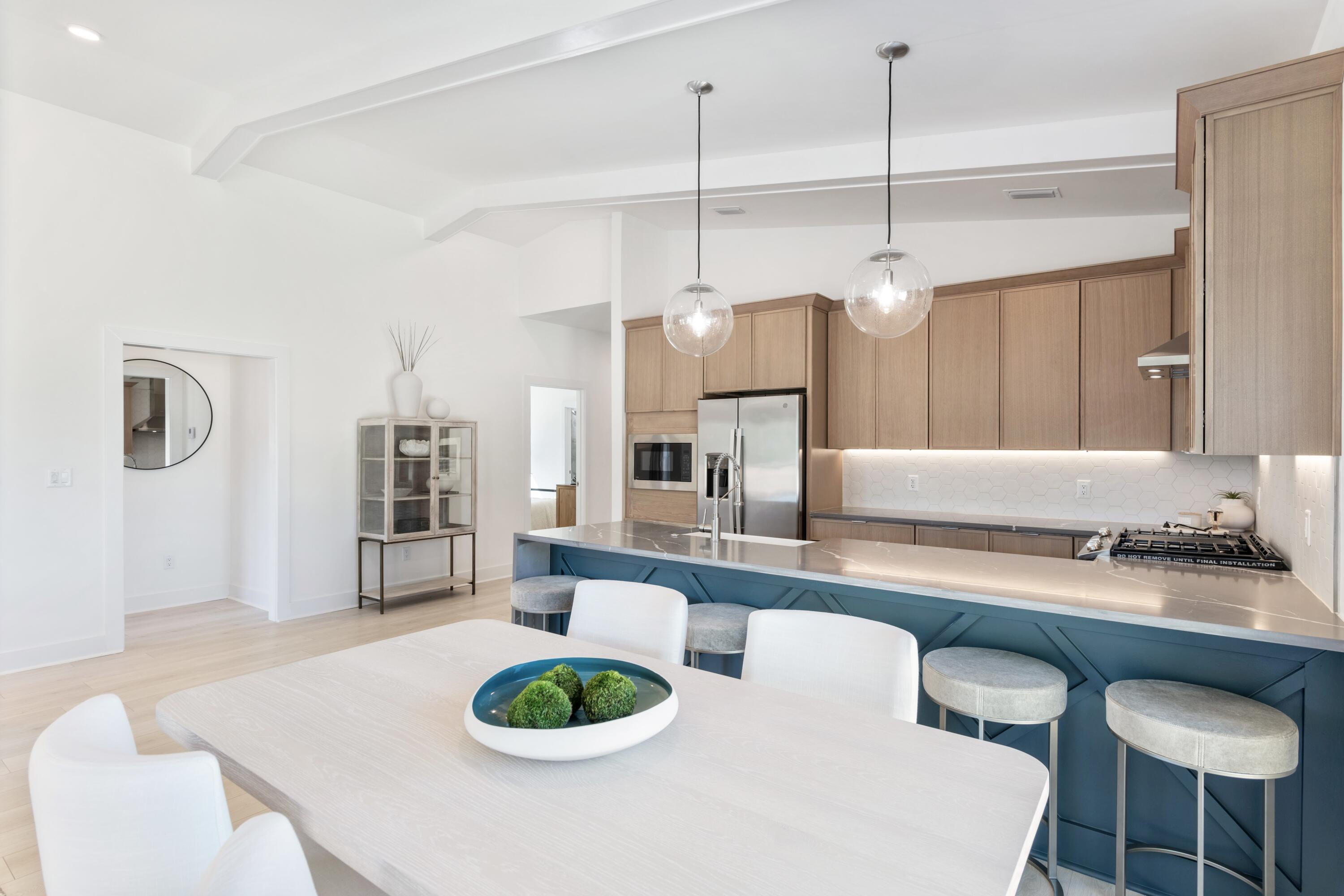 31 Asher St Inlet Beach, Unit LOT 43 Inlet Beach, FL 32461 - Photo 7 of 44 a kitchen with a table chairs stove and living room view