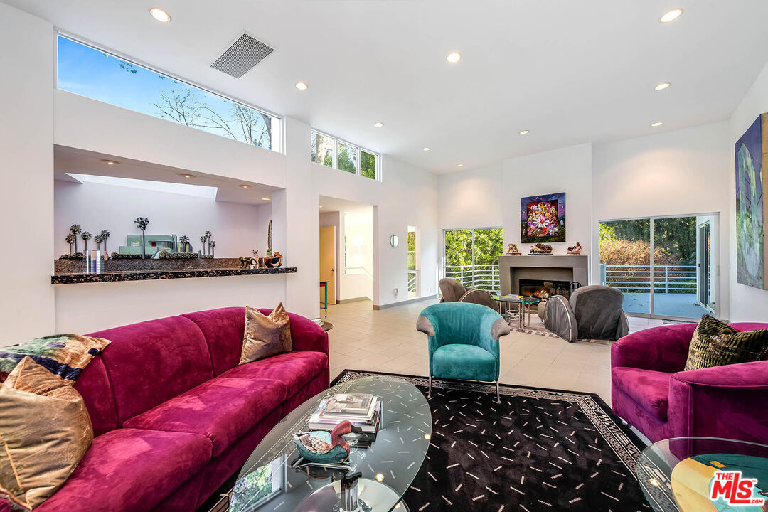 12309 Viewcrest Road Studio City, CA 91604 - Photo 13 of 52 a living room with furniture kitchen view and a large window