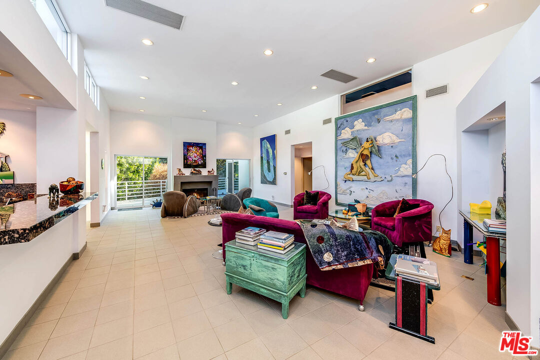 12309 Viewcrest Road Studio City, CA 91604 - Photo 14 of 52 a living room with lots of furniture and a bed