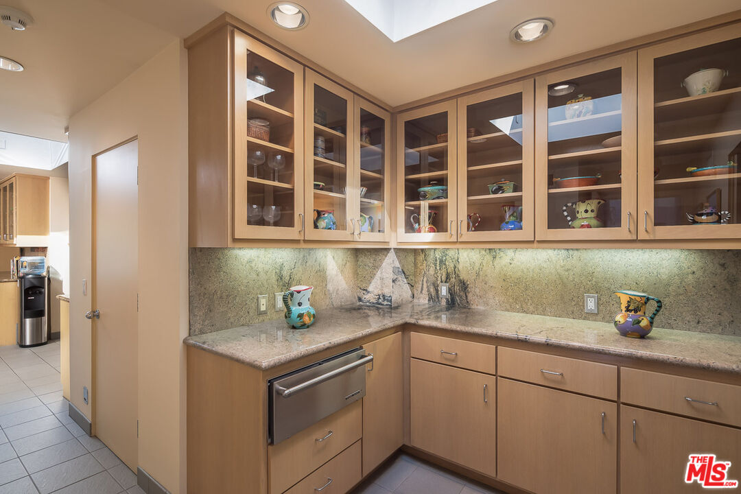 12309 Viewcrest Road Studio City, CA 91604 - Photo 19 of 52 a kitchen with a sink and cabinets