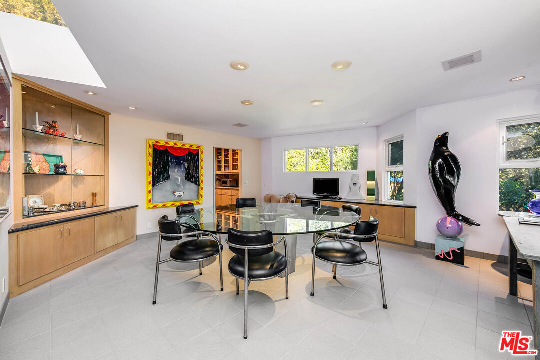 12309 Viewcrest Road Studio City, CA 91604 - Photo 20 of 52 a view of a workspace with furniture and a window