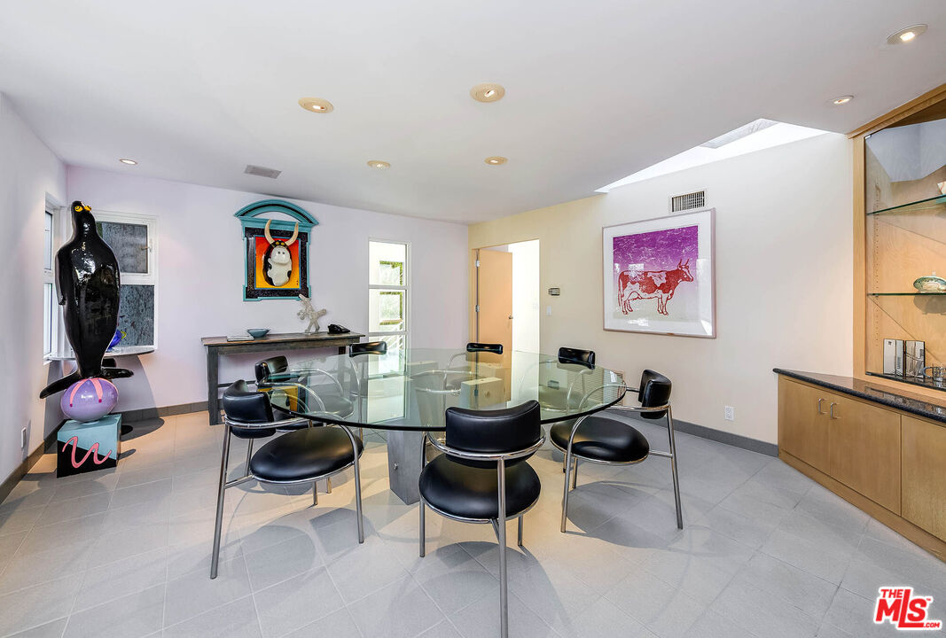 12309 Viewcrest Road Studio City, CA 91604 - Photo 22 of 52 a living room with furniture a flat screen tv and a window