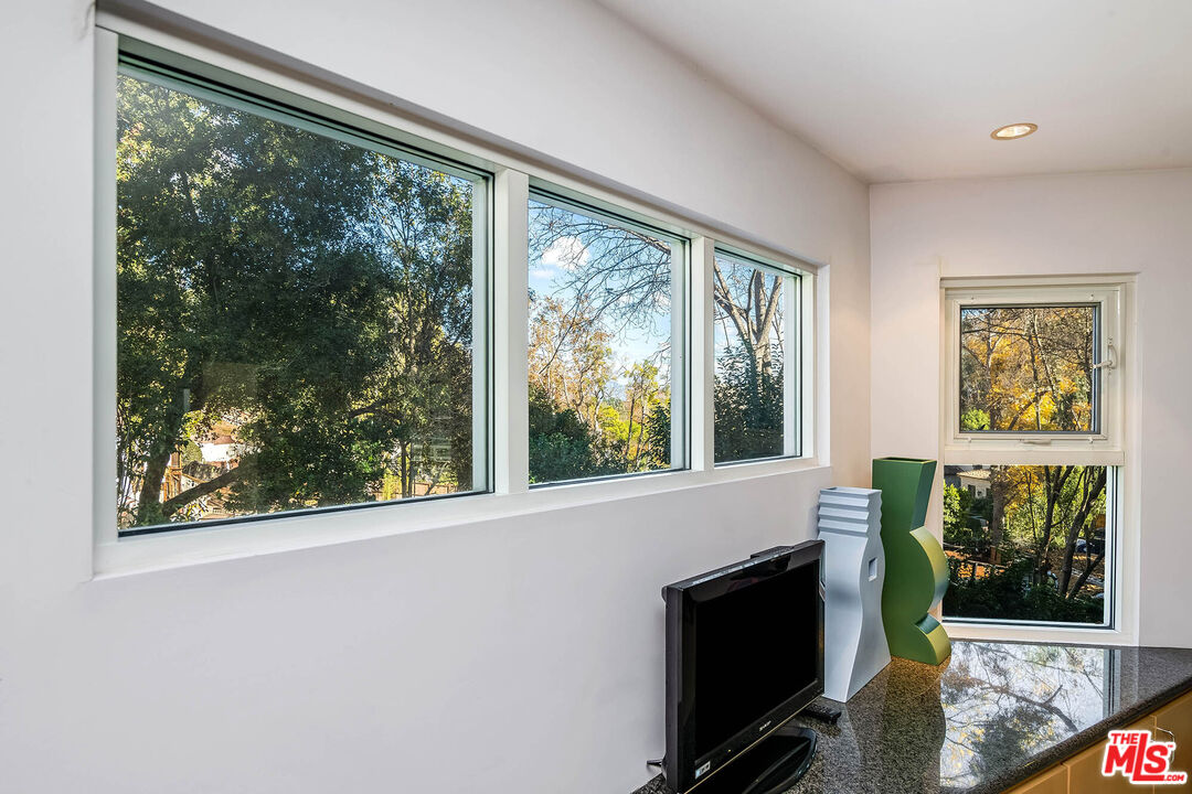 12309 Viewcrest Road Studio City, CA 91604 - Photo 23 of 52 a view of a living room and a window