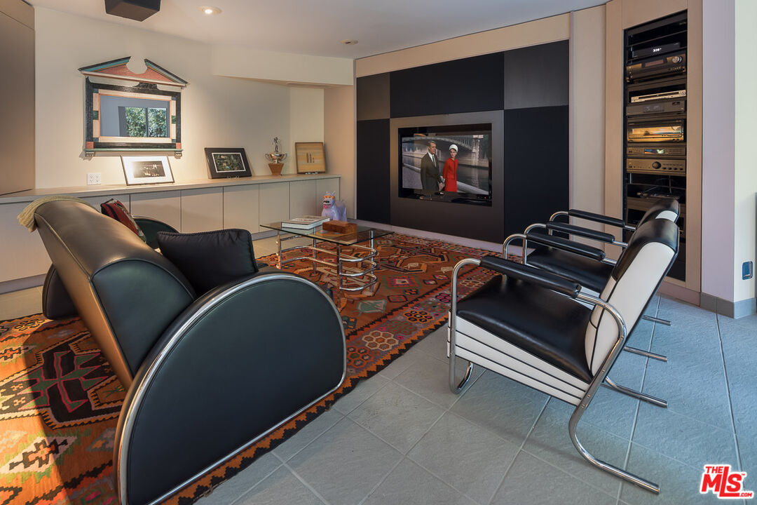 12309 Viewcrest Road Studio City, CA 91604 - Photo 31 of 52 a living room with furniture and a flat screen tv