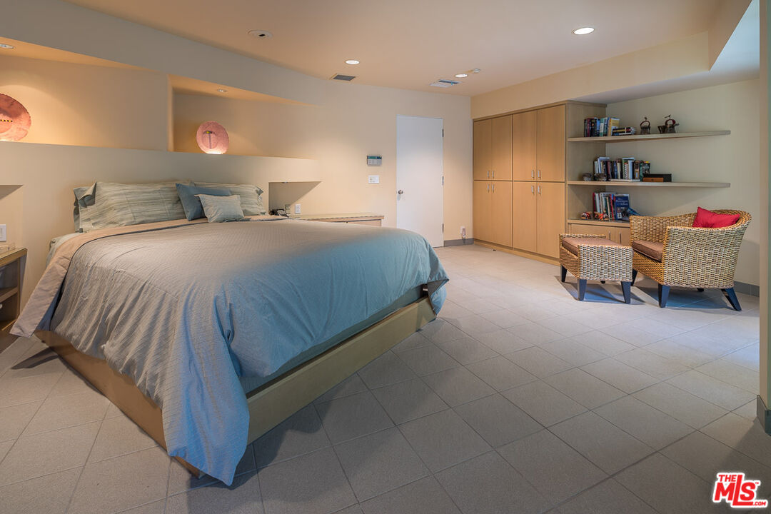 12309 Viewcrest Road Studio City, CA 91604 - Photo 32 of 52 a bedroom with a bed and a couch