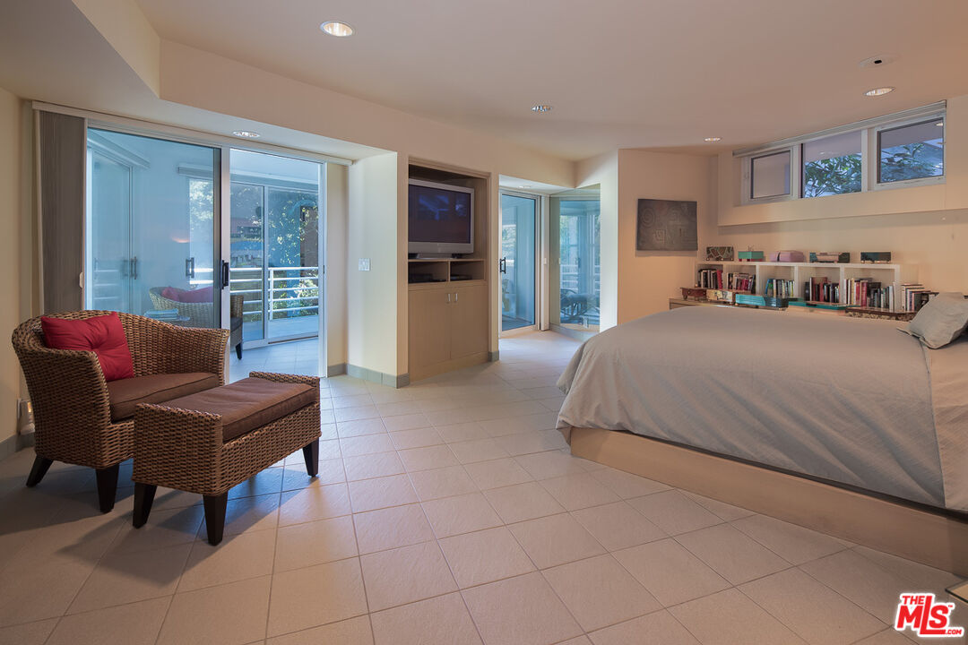 12309 Viewcrest Road Studio City, CA 91604 - Photo 33 of 52 a bedroom with a bed and a couch