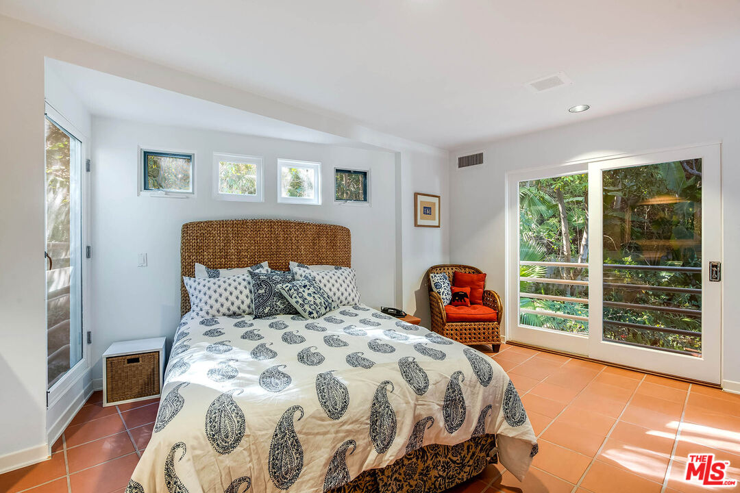 12309 Viewcrest Road Studio City, CA 91604 - Photo 38 of 52 a bedroom with a bed and a large window