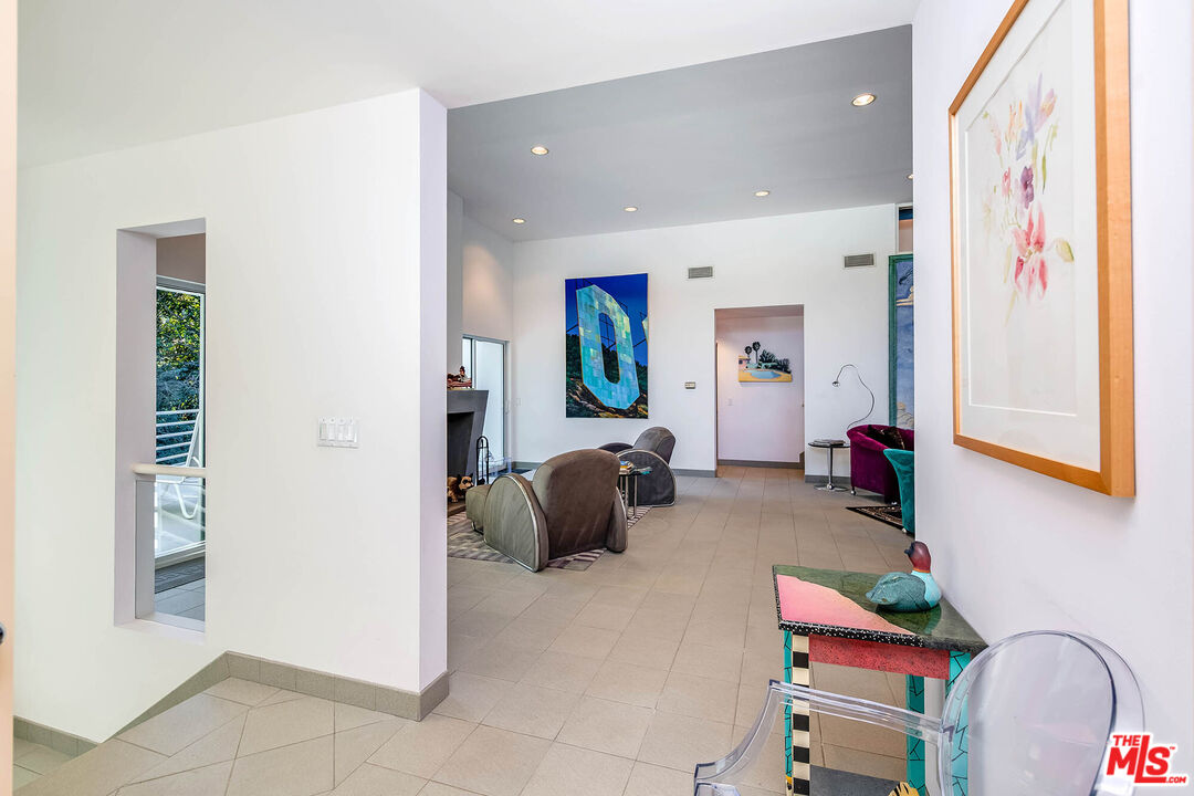 12309 Viewcrest Road Studio City, CA 91604 - Photo 6 of 52 a bedroom with furniture and a wooden floor