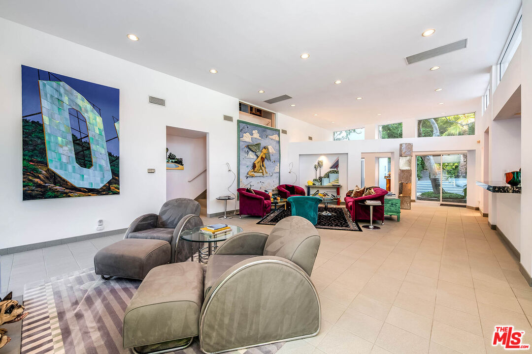 12309 Viewcrest Road Studio City, CA 91604 - Photo 9 of 52 a living room with furniture and a large window