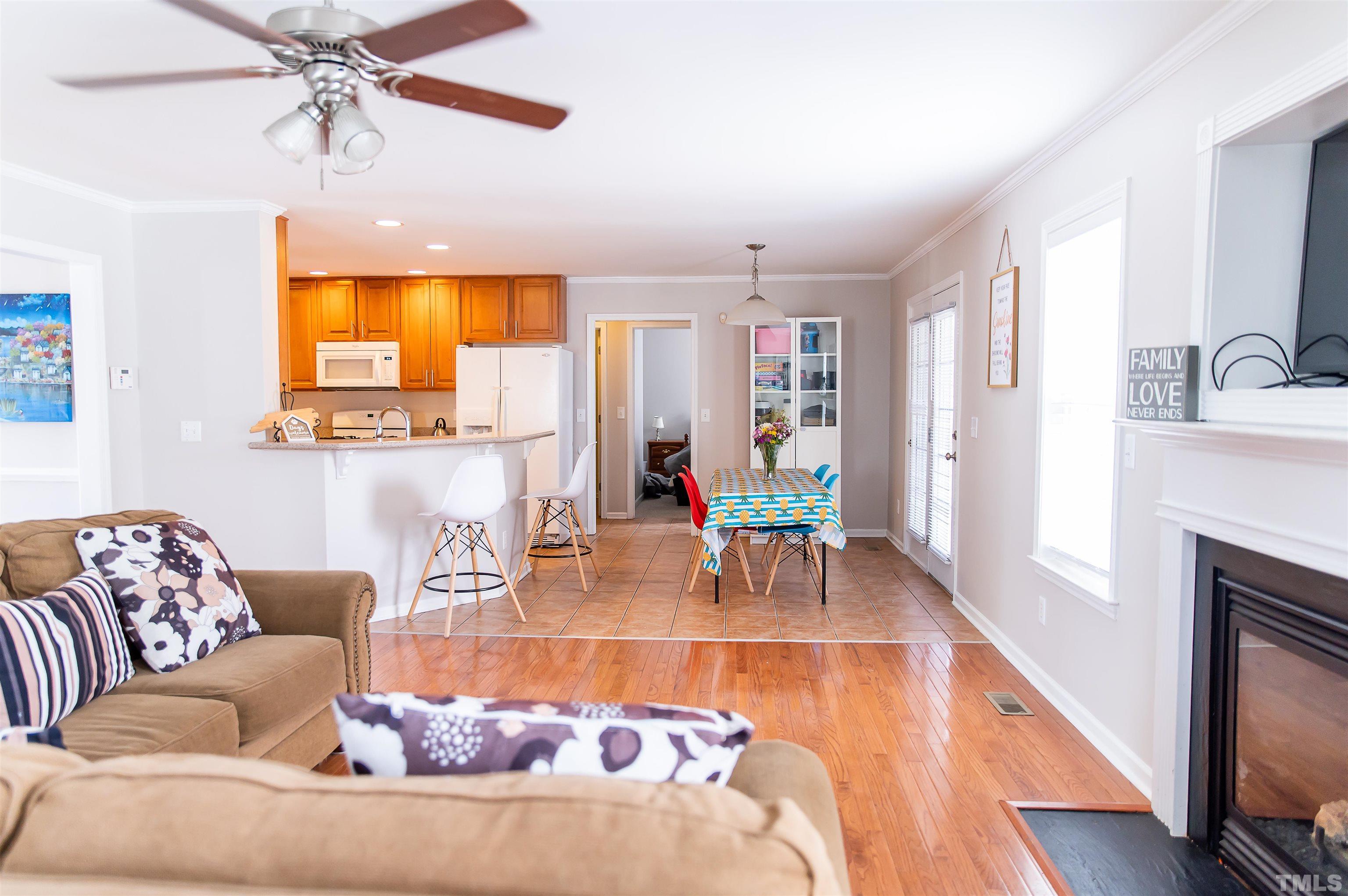 917 Pristine Lane Rolesville, NC 27571 - Photo 15 of 35 a living room with furniture and a fireplace