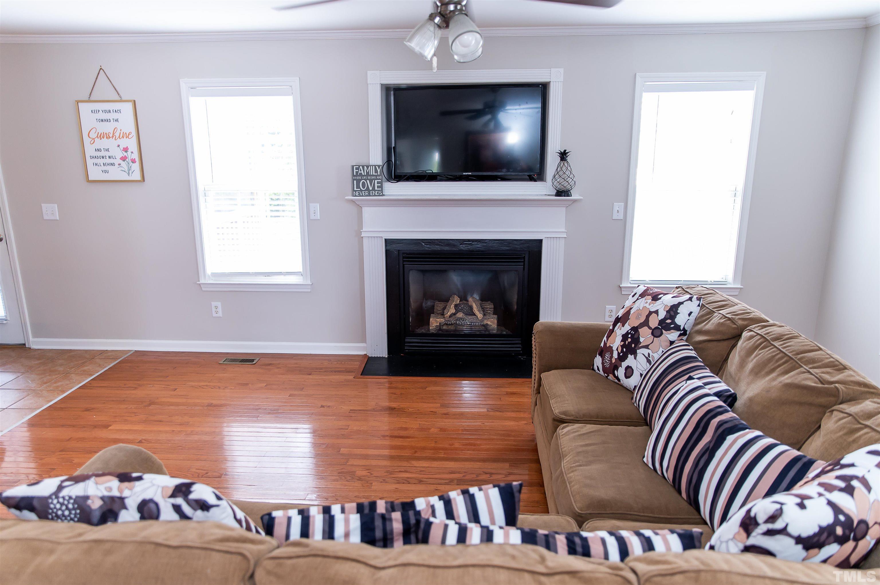 917 Pristine Lane Rolesville, NC 27571 - Photo 19 of 35 a living room with furniture and a fireplace