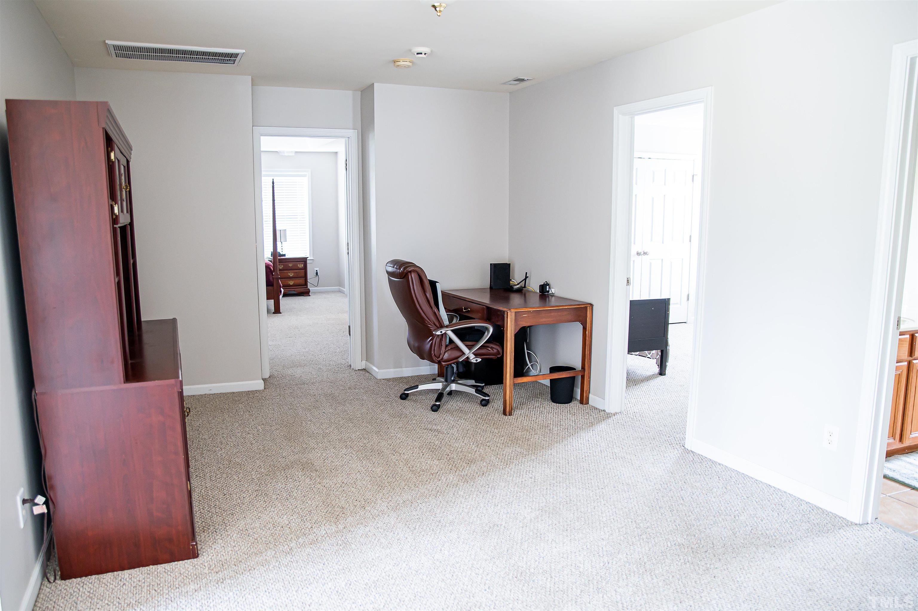 917 Pristine Lane Rolesville, NC 27571 - Photo 20 of 35 a view of a workspace with furniture and a window