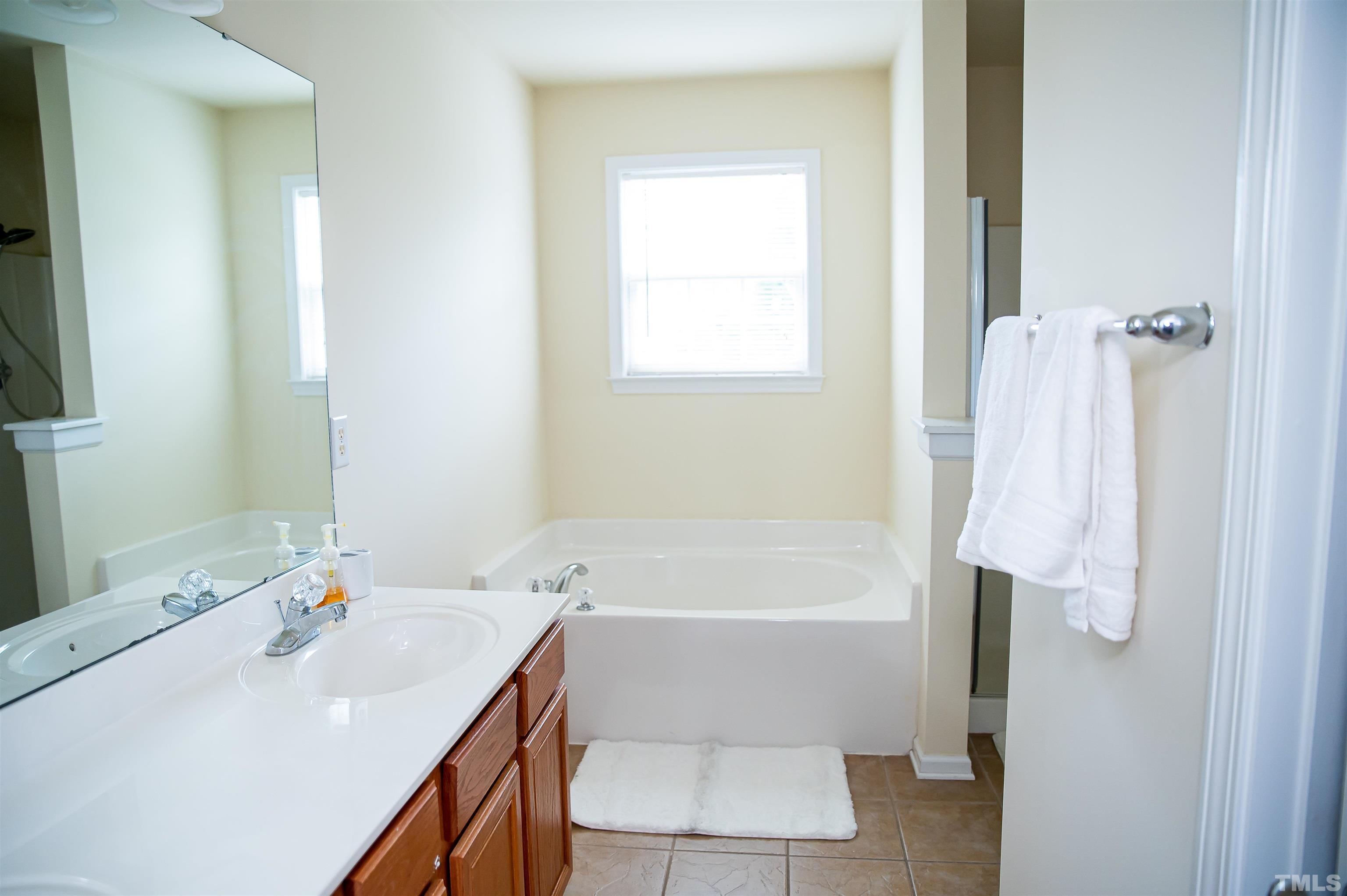 917 Pristine Lane Rolesville, NC 27571 - Photo 25 of 35 a bathroom with a sink toilet and shower
