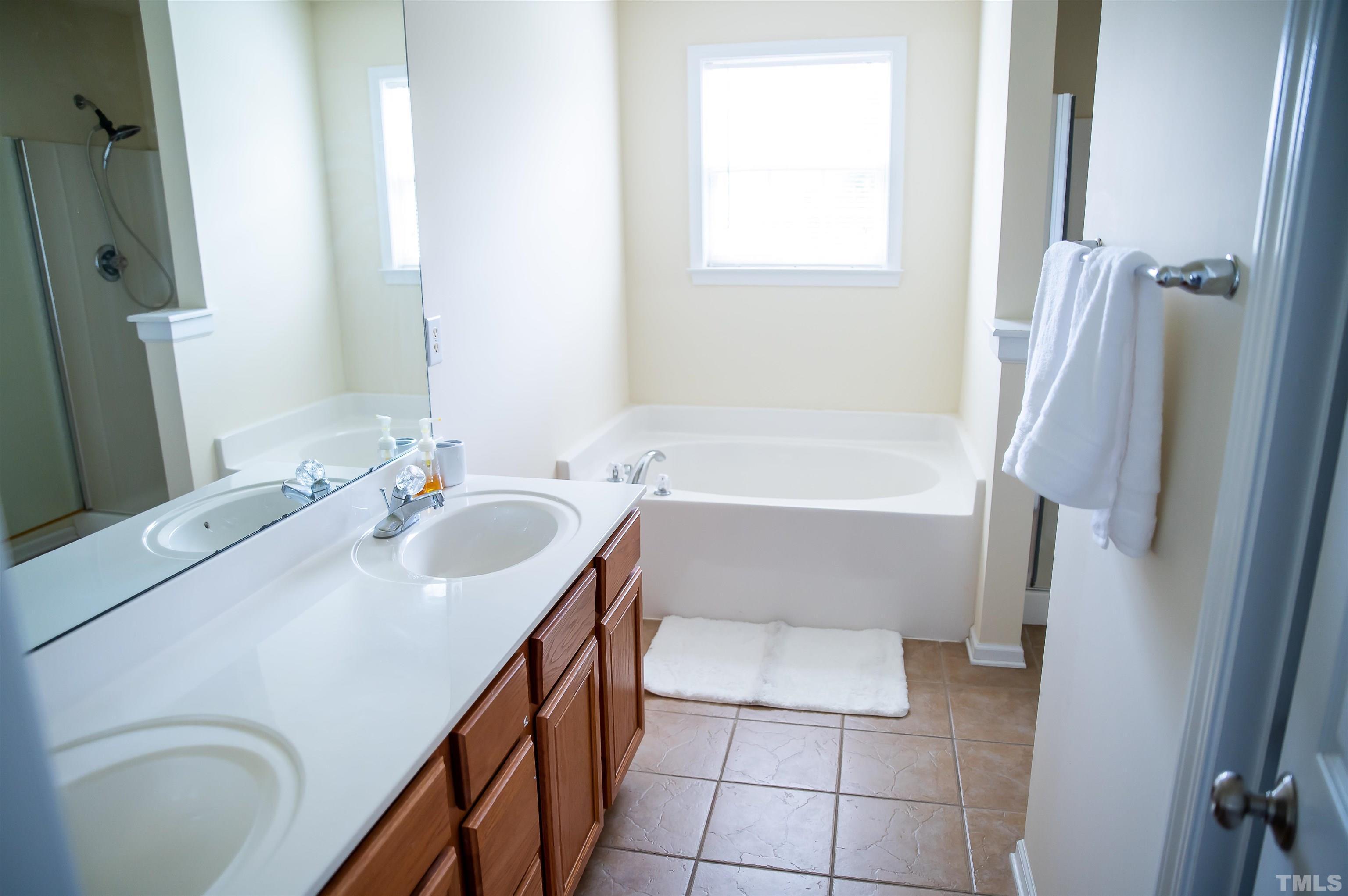 917 Pristine Lane Rolesville, NC 27571 - Photo 26 of 35 a bathroom with a sink a toilet and shower