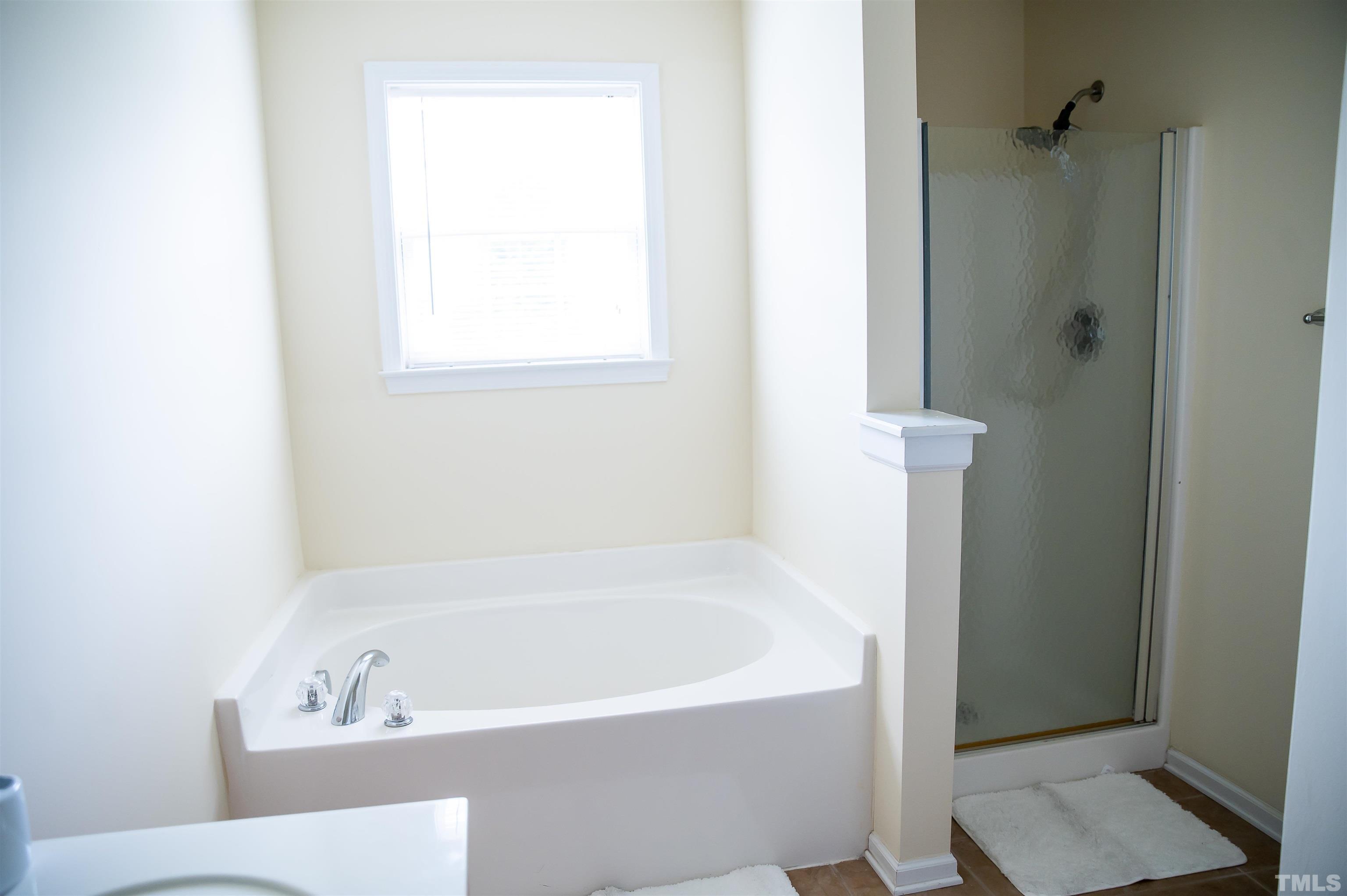917 Pristine Lane Rolesville, NC 27571 - Photo 27 of 35 a bathroom with a bathtub