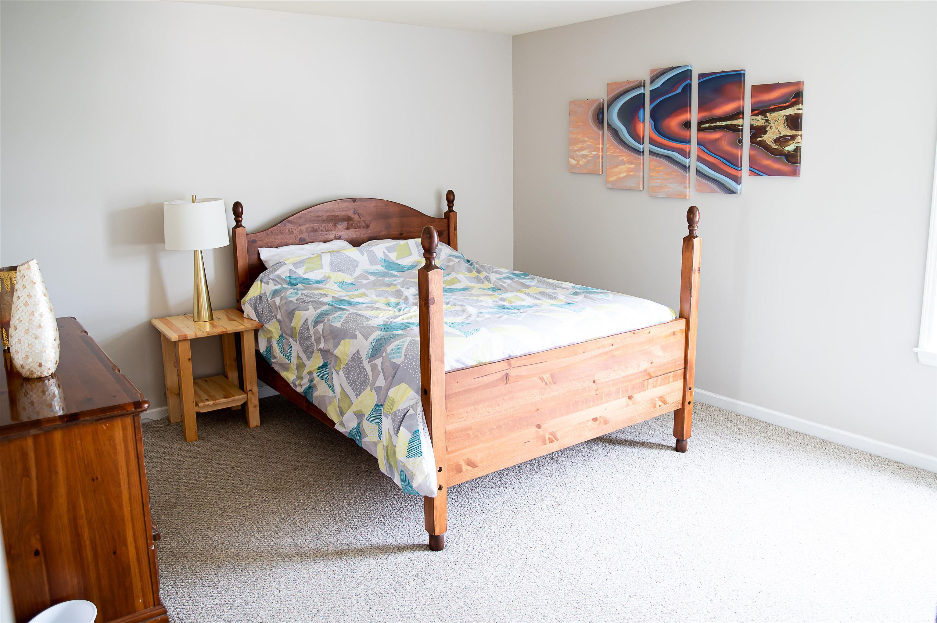 917 Pristine Lane Rolesville, NC 27571 - Photo 32 of 35 a bedroom with a bed and a cabinets