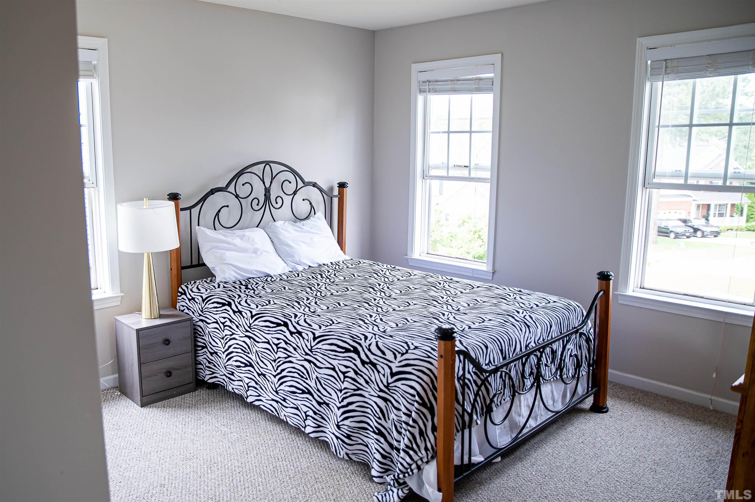917 Pristine Lane Rolesville, NC 27571 - Photo 33 of 35 a bedroom with a bed and a window
